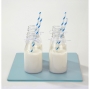 Pack de 4 mini botellas de leche.